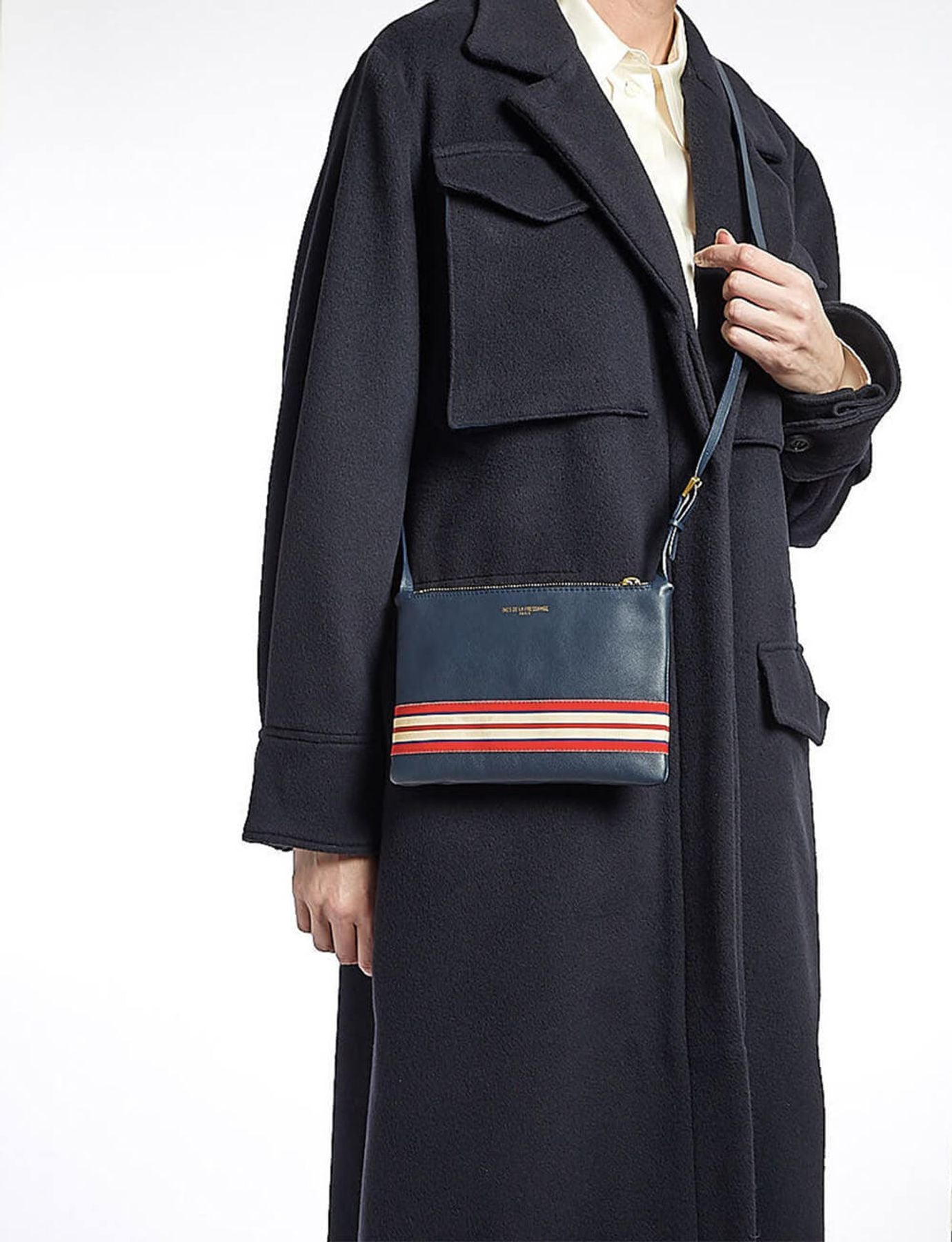 Le Parisien navy leather clutch bag