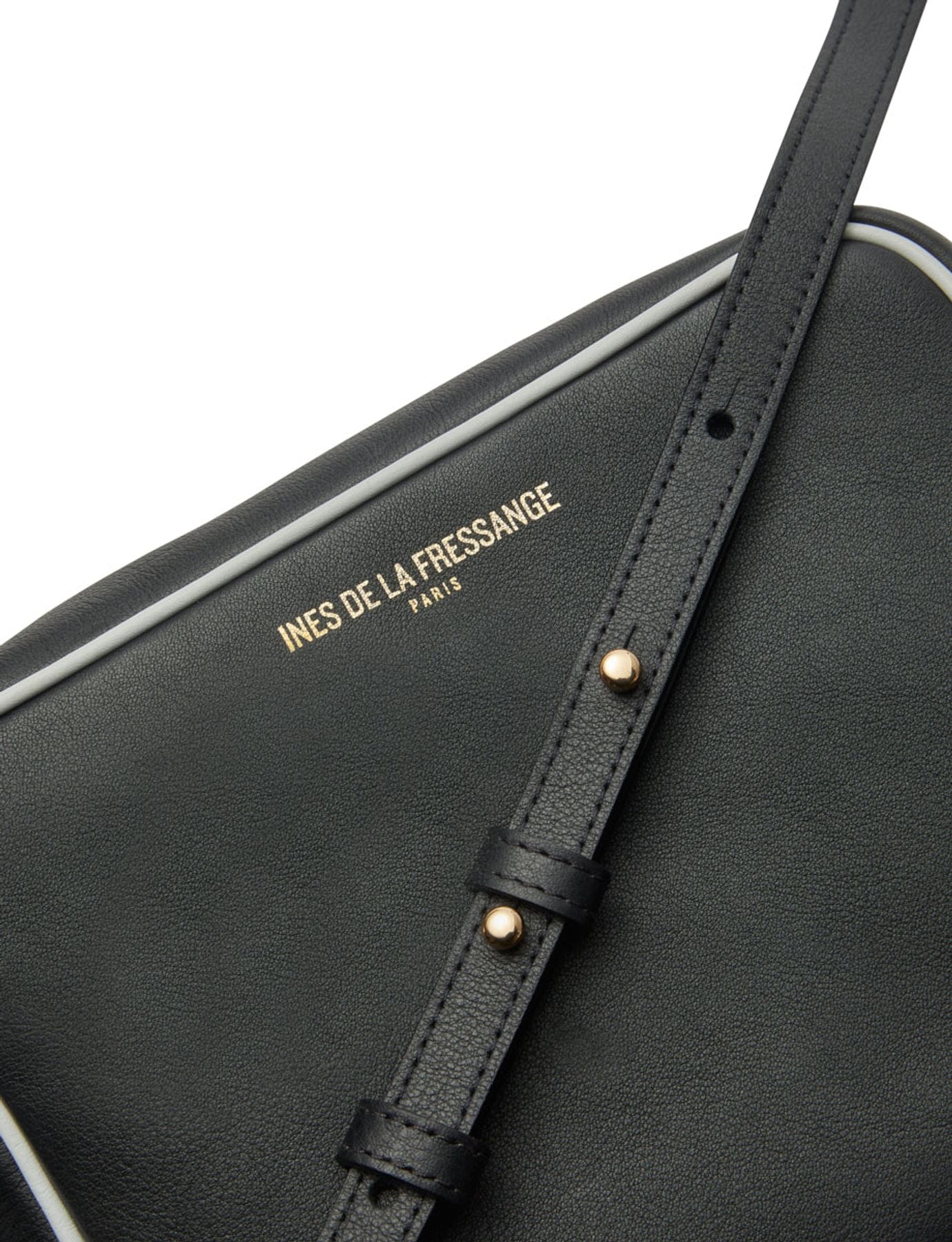 Bolso Marcia de piel negra con ribete blanco